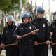 Police officers in riot gear walk toward protesters along Reisterstown Road near Mondawmin Mall in Baltimore April 27, 2015.
DREW ANGERER/GETTY IMAGES